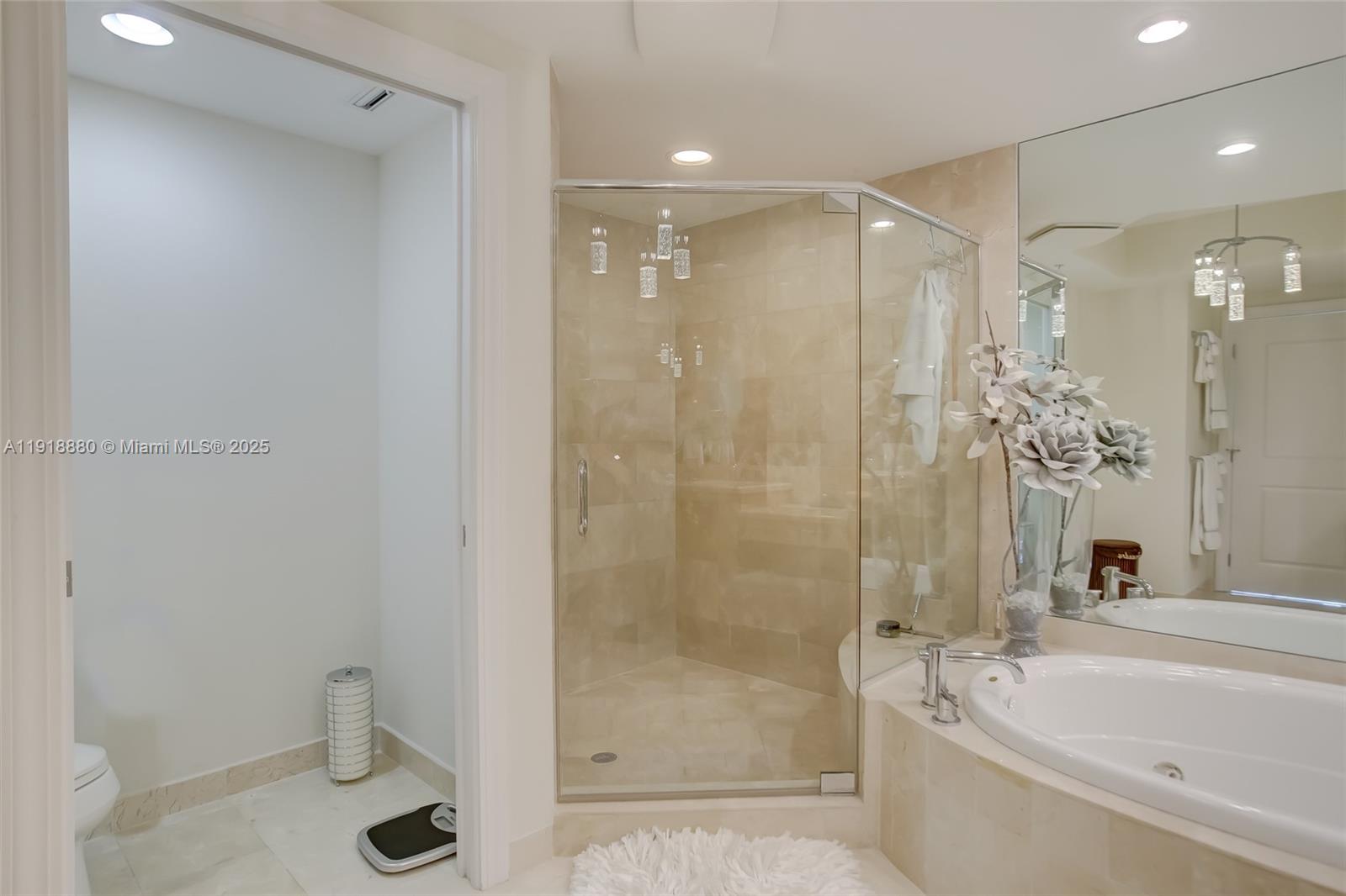 1 North Ocean Boulevard, Unit 1011 Pompano Beach, FL 33062 - Photo 15 of 48 a bathroom with a shower a bathtub and a toilet