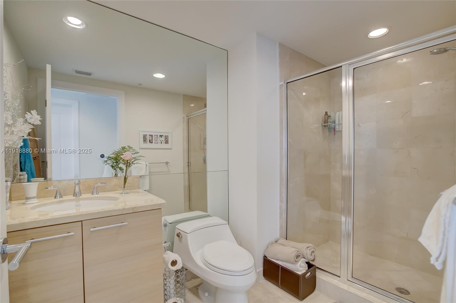 1 North Ocean Boulevard, Unit 1011 Pompano Beach, FL 33062 - Photo 19 of 48 a bathroom with a sink toilet and shower