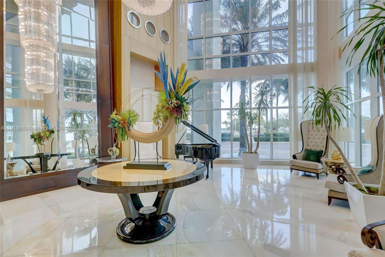 1 North Ocean Boulevard, Unit 1011 Pompano Beach, FL 33062 - Photo 2 of 48 a living room with fireplace furniture and a potted plant