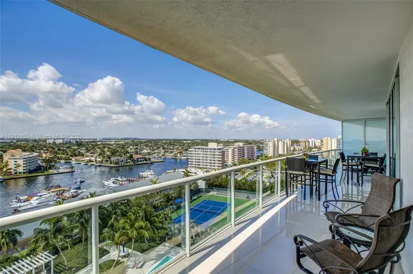 a view of a balcony with lake view and mountain view