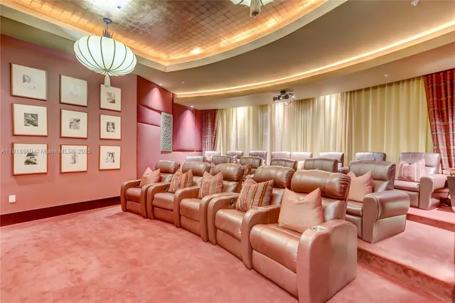 a view of a dining room with furniture and a chandelier