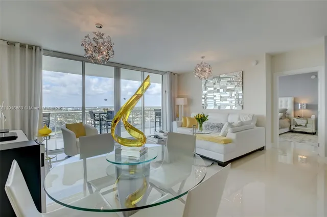 a view of living room with furniture and floor to ceiling windows