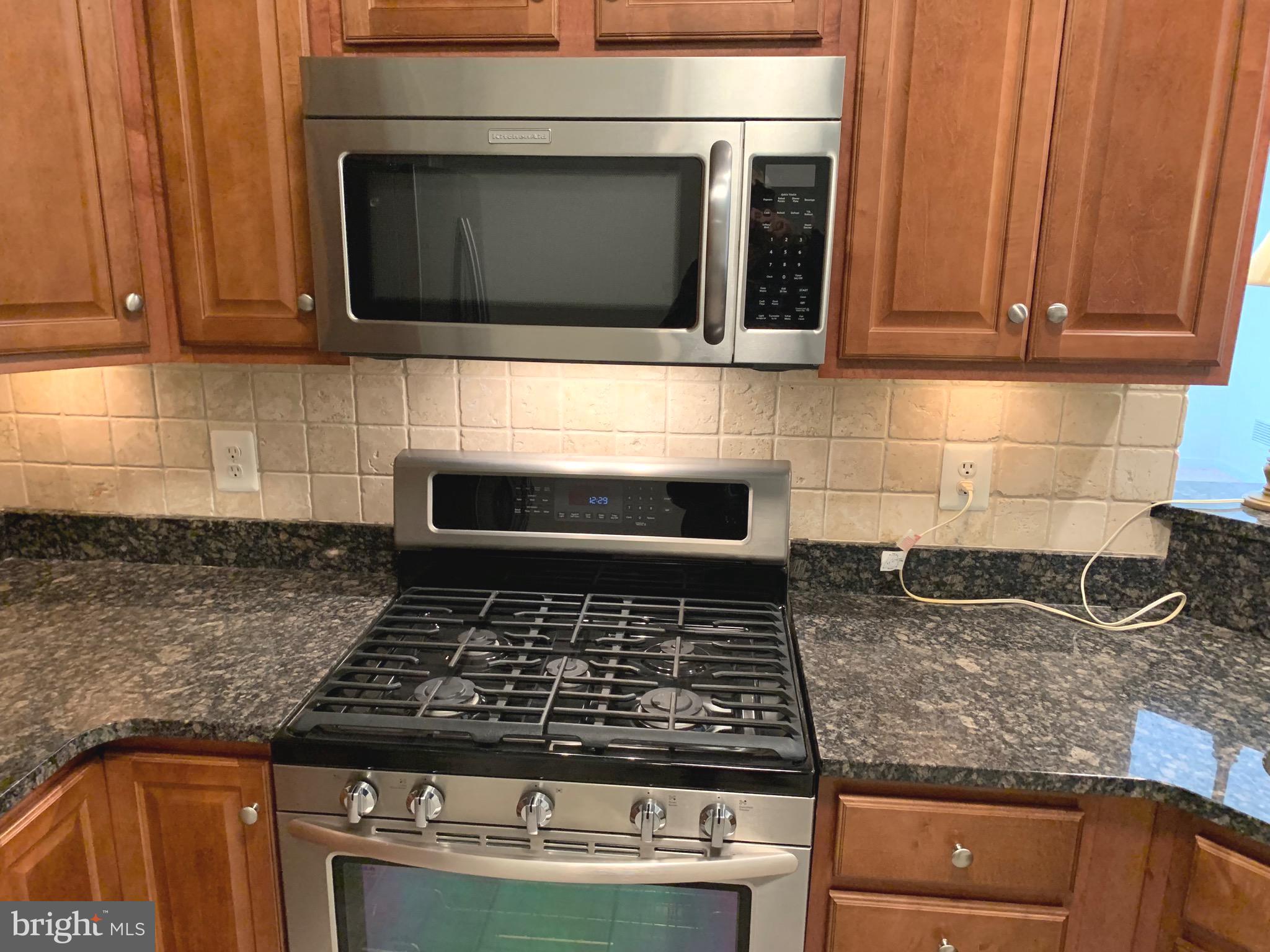 8970 Fascination Court, Unit 111 Lorton, VA 22079 - Photo 16 of 60 Gas Stove and Built-in Microwave