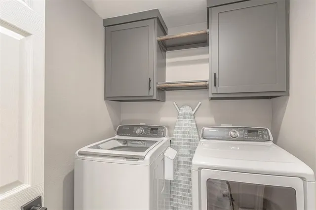 a utility room with dryer and washer