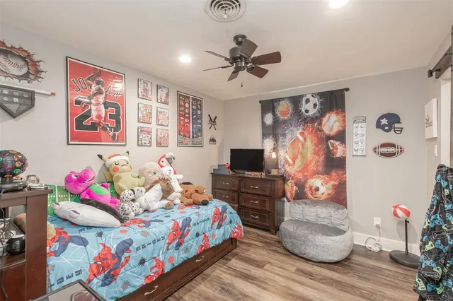 a bedroom with a bed and furniture