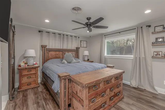 a bedroom with a bed and a dresser