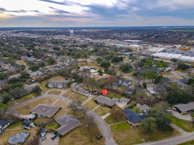 an aerial view of residential houses with outdoor space