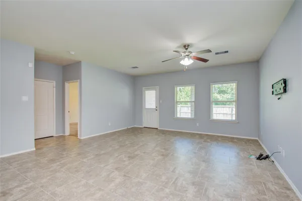 a view of an empty room with a window