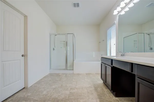 a bathroom with a sink a vanity and a mirror