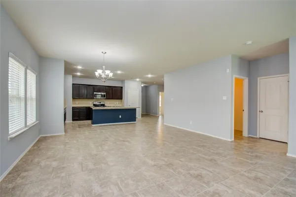 a view of kitchen and kitchen with furniture