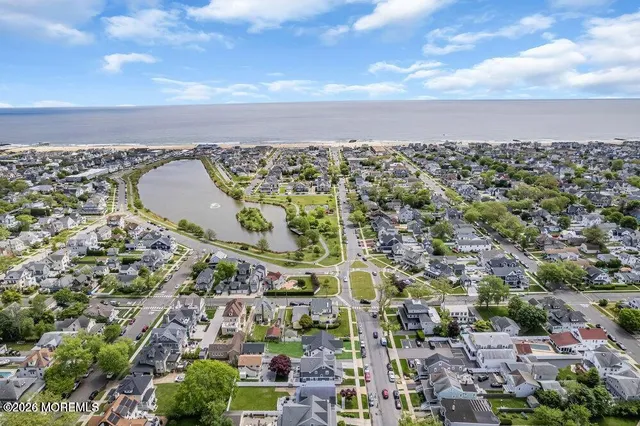 a view of a swimming pool with an ocean view