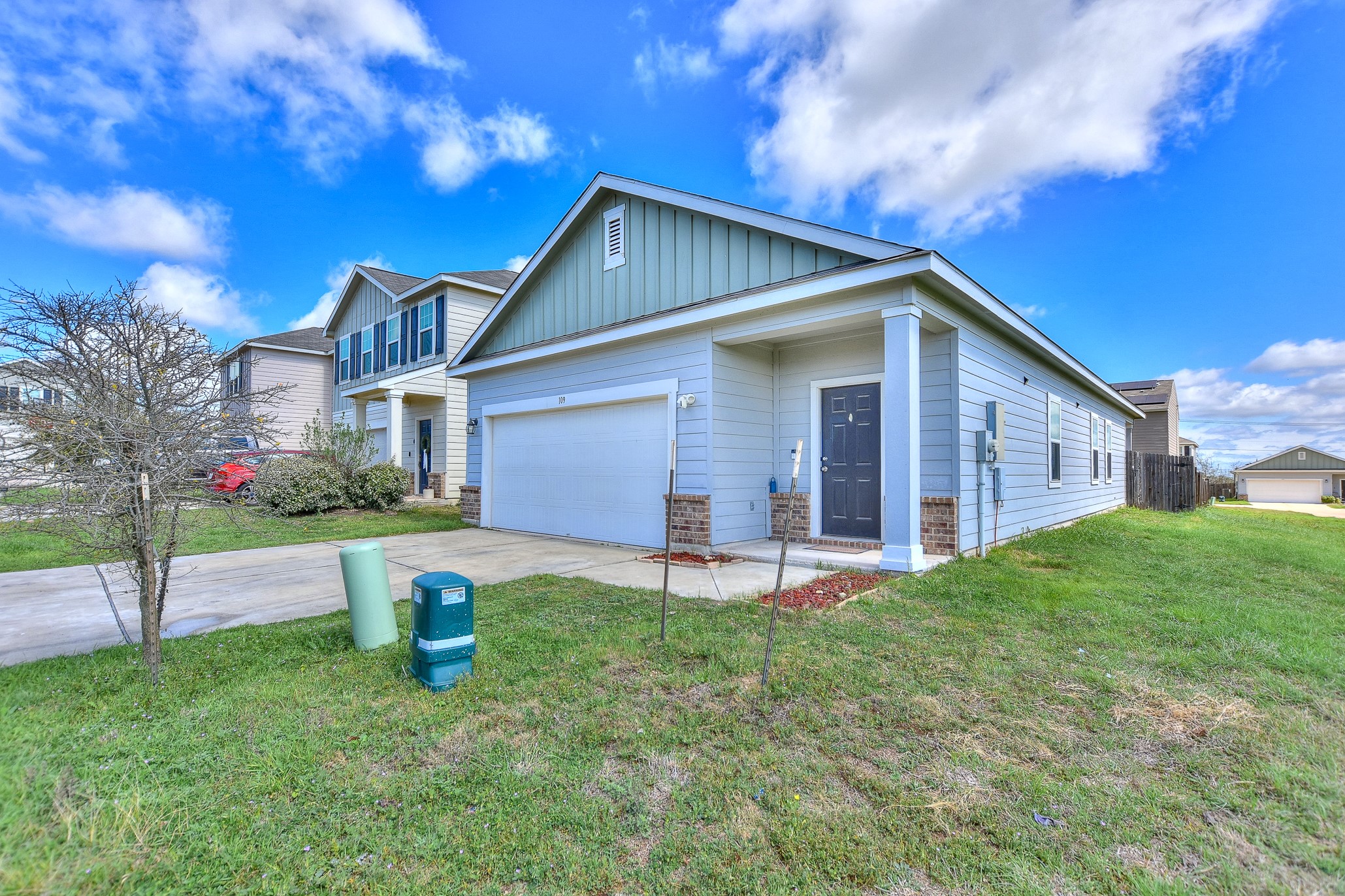109 Helios Drive Jarrell, TX 76537 - Photo 1 of 36 a front view of house with yard and outdoor seating
