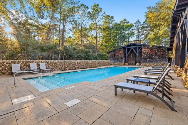 a view of a backyard with sitting area