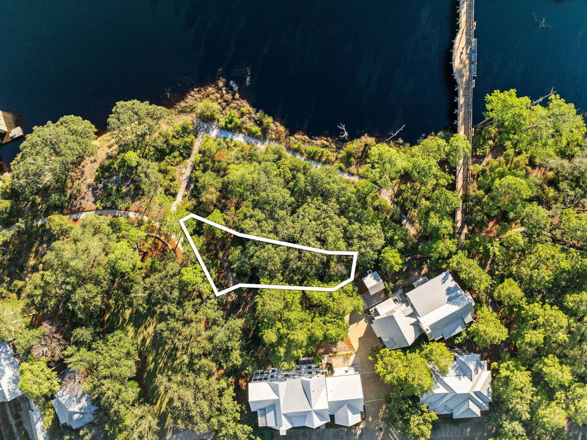 Lot 3 Dewberry Lane Santa Rosa Beach, FL 32459 - Photo 12 of 12 a backyard of a house with lots of green space and a fountain