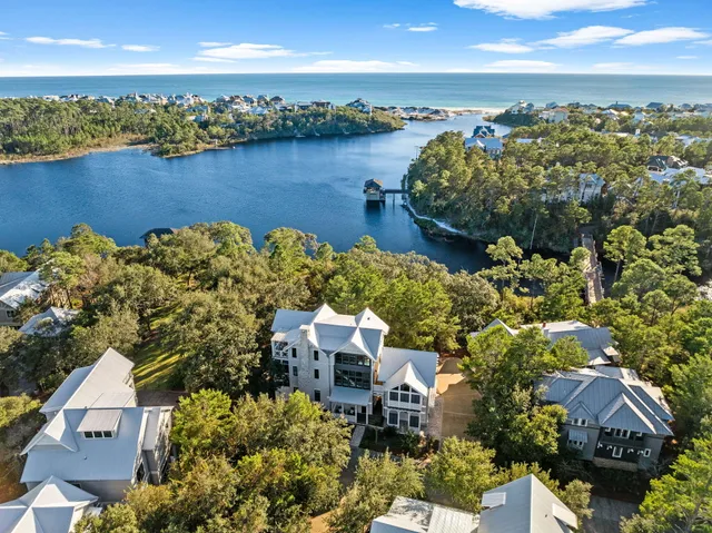 an aerial view of a house with a lake view