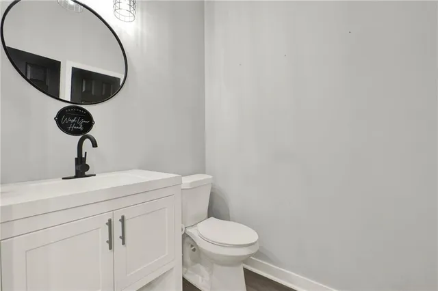 a bathroom with a toilet and a sink
