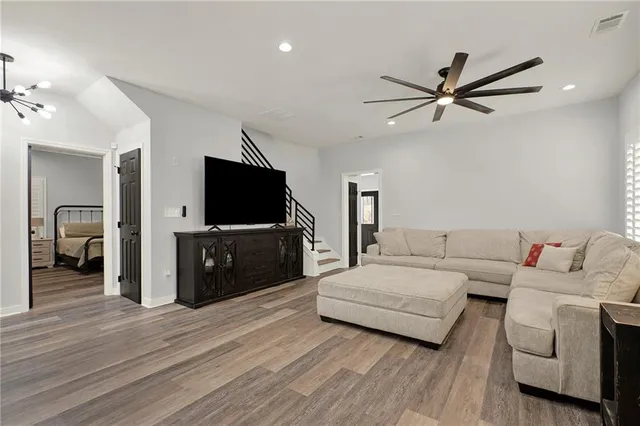 a living room with a couch and a flat screen tv
