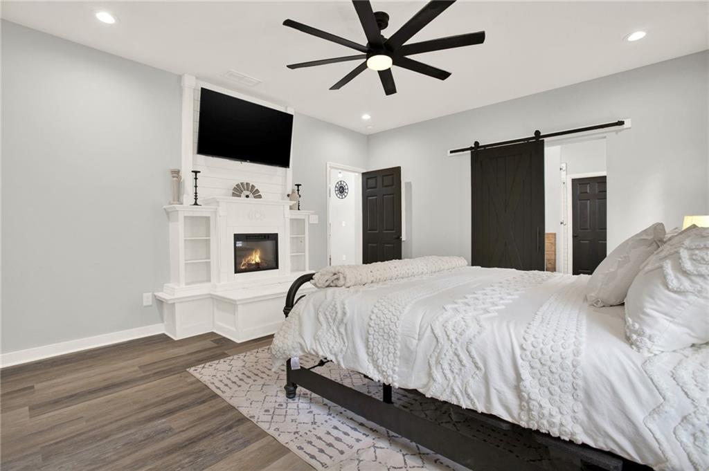 92 Autumn Path Rockmart, GA 30153 - Photo 19 of 44 a bedroom with a bed and a flat screen tv