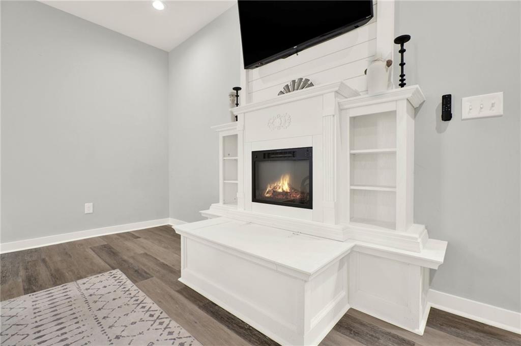 92 Autumn Path Rockmart, GA 30153 - Photo 20 of 44 a room with a fireplace and a wooden floor