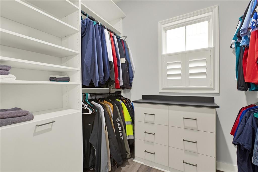 92 Autumn Path Rockmart, GA 30153 - Photo 23 of 44 a view of walk in closet with clothes and shoes