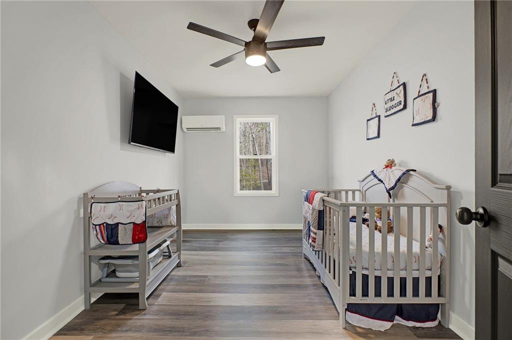 92 Autumn Path Rockmart, GA 30153 - Photo 25 of 44 a living room with furniture and a flat screen tv