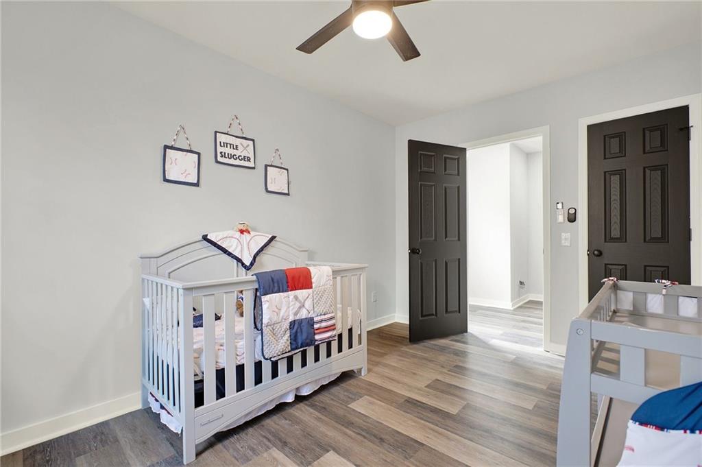 92 Autumn Path Rockmart, GA 30153 - Photo 26 of 44 a bedroom with furniture and a baby crib