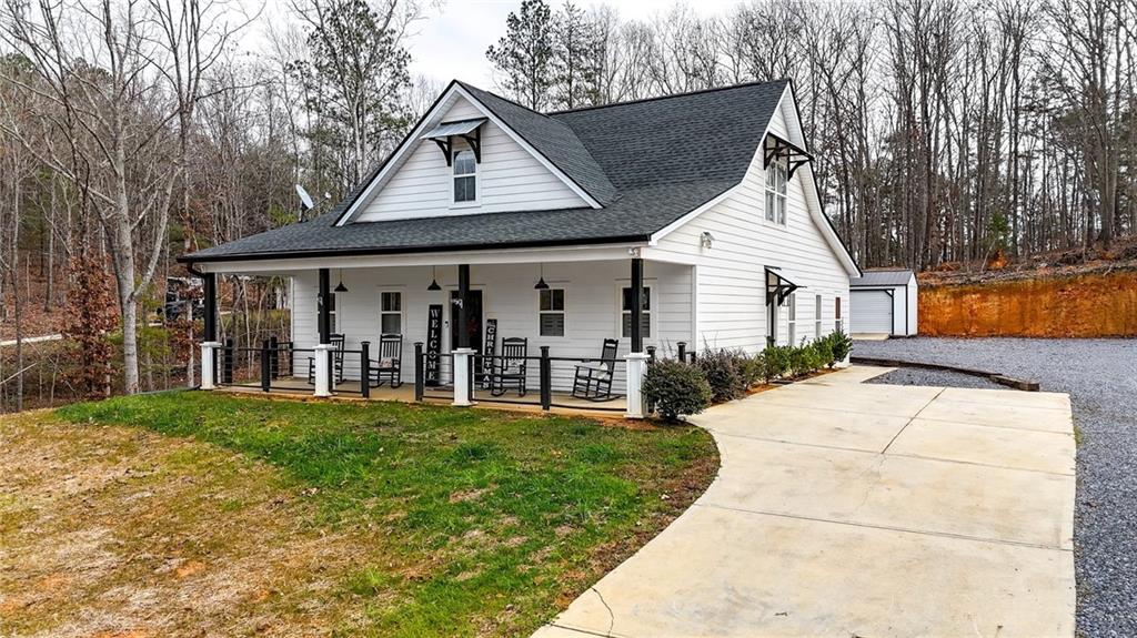 92 Autumn Path Rockmart, GA 30153 - Photo 3 of 44 a view of a white house with a big yard and potted plants