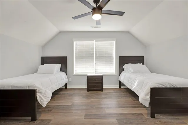 a bed room with a bed and a window