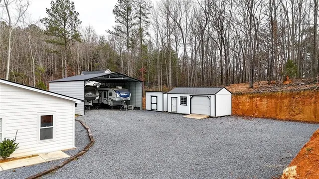 a view of a house with a yard and garage