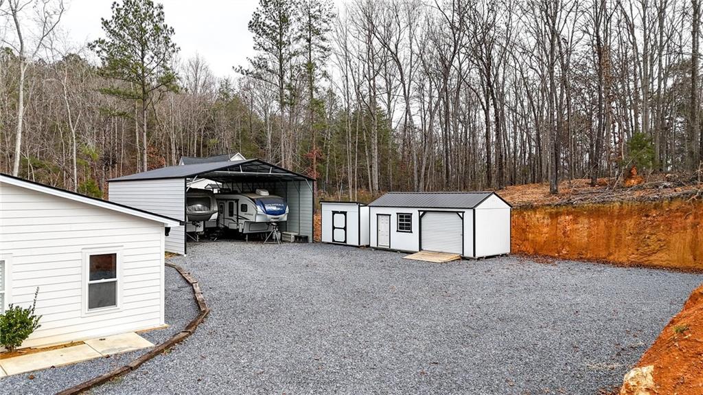 92 Autumn Path Rockmart, GA 30153 - Photo 37 of 44 a view of a house with backyard and trees