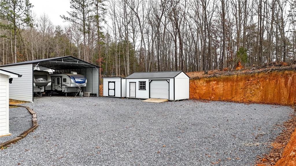 92 Autumn Path Rockmart, GA 30153 - Photo 38 of 44 a view of a house with a yard and garage