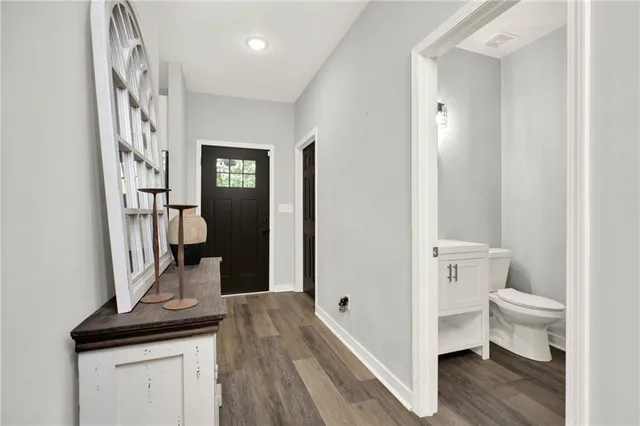 a view of bathroom with a sink and a mirror