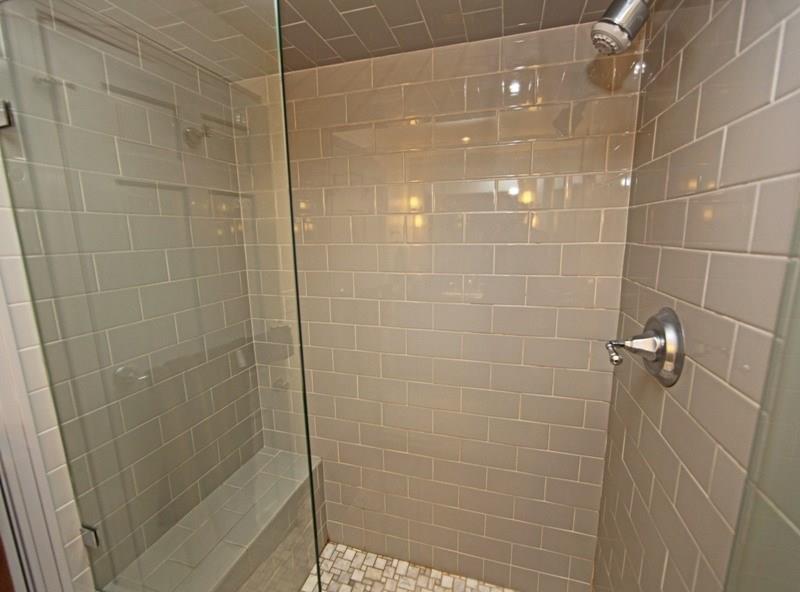 9467 North Florence Road Pittsburgh, PA 15237 - Photo 13 of 22 Ceramic Tile Shower with Elegant Tile & an Elegant Clear Glass Door... Please Take Note of the Wide Bench Seat.