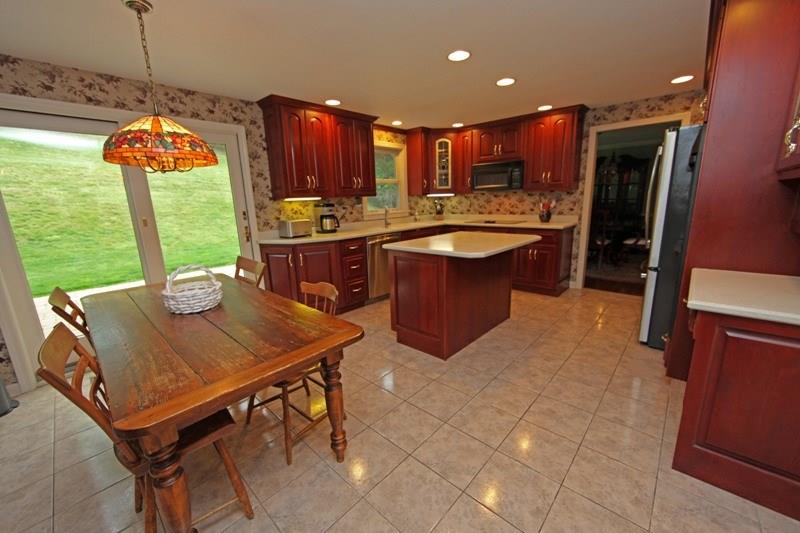 9467 North Florence Road Pittsburgh, PA 15237 - Photo 3 of 22 Tall Cherry Cabinets with Corian Counters.... Plenty of Counter Space & Gorgeous Appliances