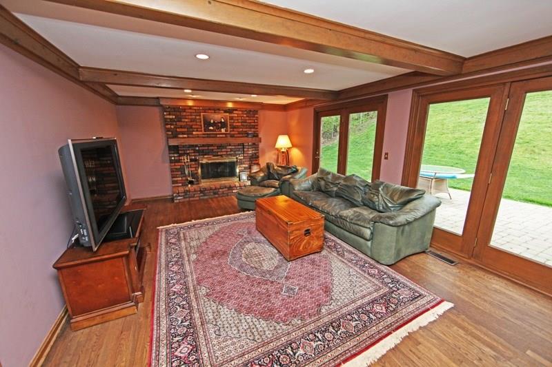 9467 North Florence Road Pittsburgh, PA 15237 - Photo 7 of 22 Handsome Den with a Raised Hearth Brick Fireplace, Harwood Floors & a Panoramic View