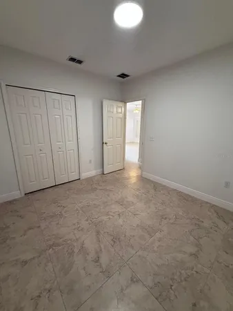 a view of an empty room and a window