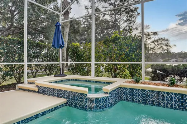 a view of a chair and tables on the roof deck
