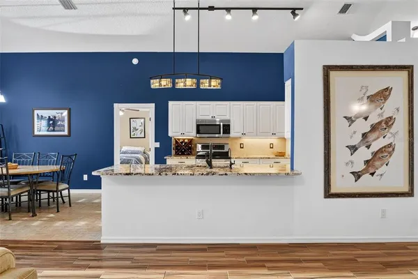 a view of a dining room with furniture and a large window