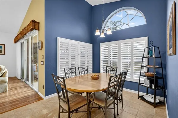 a large kitchen with granite countertop a sink and cabinets