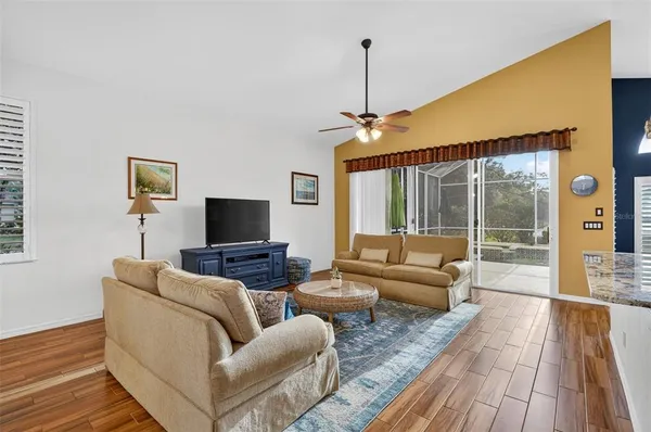 a living room with couch and a large window