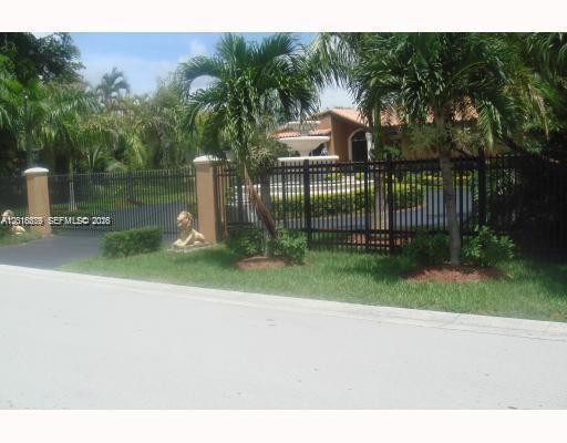 12425 Southwest 43rd Street Miami, FL 33175 - Photo 3 of 11 a view of a park with iron fence