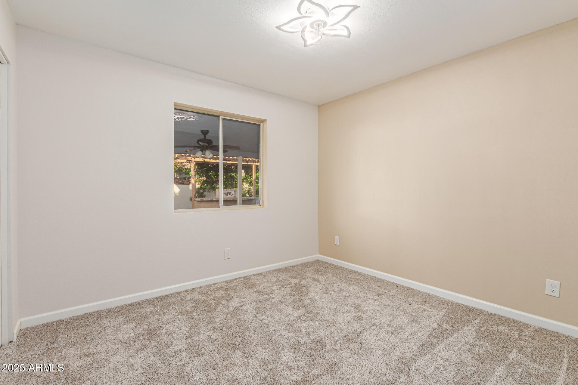 1232 East McLellan Road Mesa, AZ 85203 - Photo 24 of 31 an empty room with a window