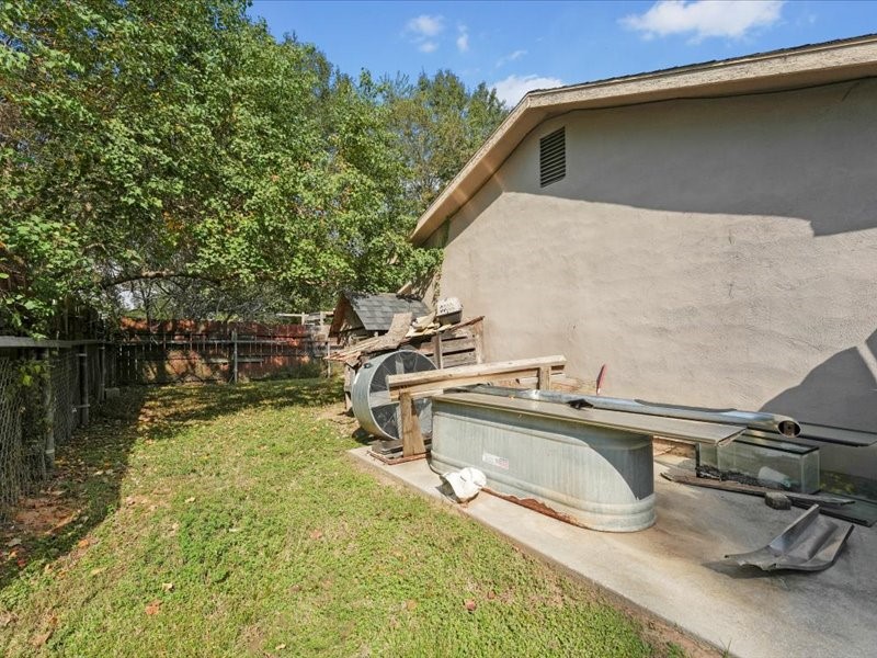 1418 South 7th Street Conroe, TX 77301 - Photo 16 of 36 a view of a house with pool