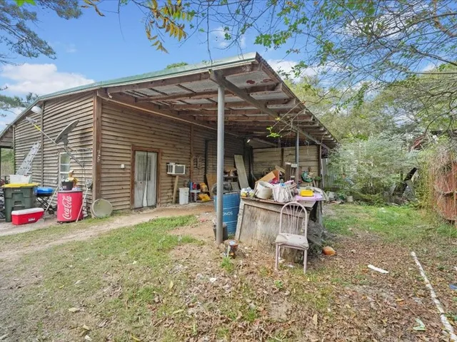 a view of a chairs and tables in patio with a table and chairs