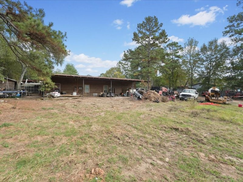 1418 South 7th Street Conroe, TX 77301 - Photo 27 of 36 a view of outdoor space with garden view