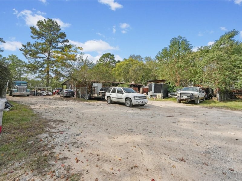 1418 South 7th Street Conroe, TX 77301 - Photo 31 of 36 a car parked on the side of the road