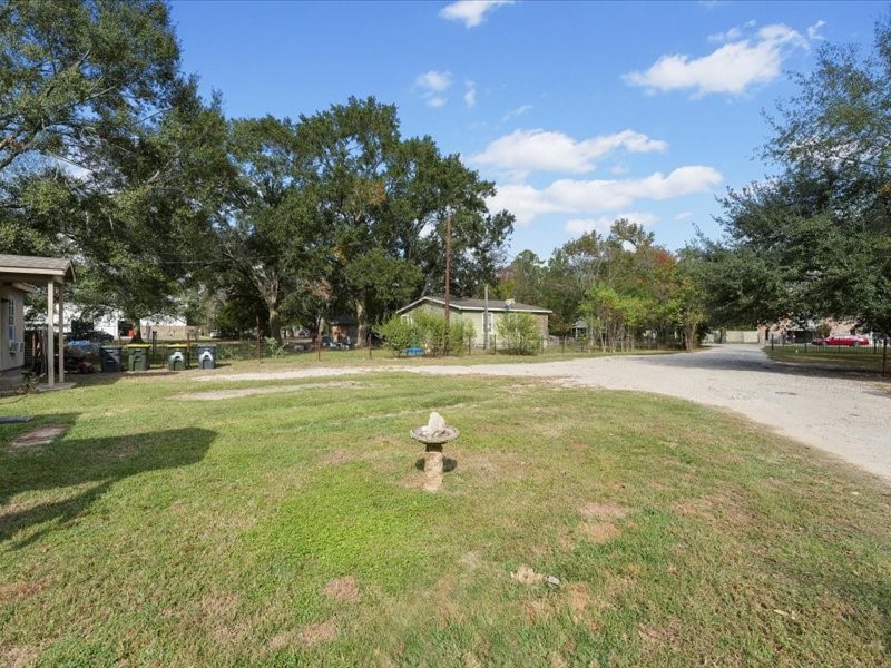1418 South 7th Street Conroe, TX 77301 - Photo 32 of 36 a swimming pool view with a outdoor seating