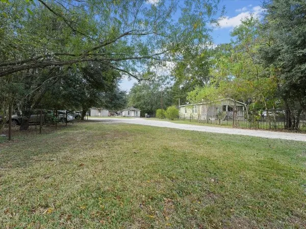 a view of outdoor space with deck and yard