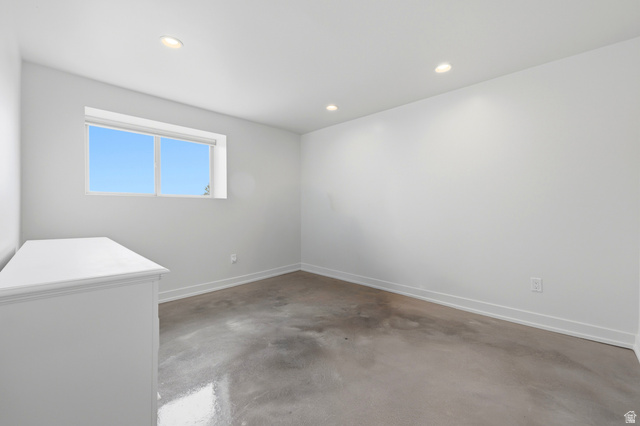 1389 Millbrook Way Bountiful, UT 84010 - Photo 55 of 74 Room featuring a large window, recessed lighting, baseboard trim, and a hard-surface floor