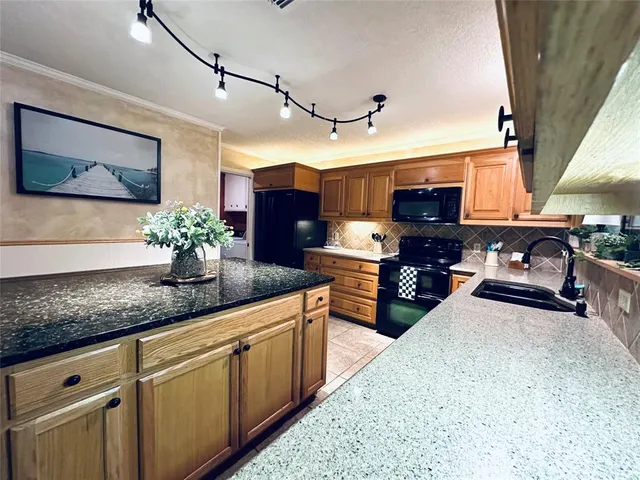 a kitchen with granite countertop lots of counter top space